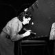 Mrs. Williams on the many works inspectors casting her critical eyes over the work done by her fellow men and women workers on parts for the Halifax bombers, somewhere in England, on April 15, 1942.